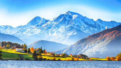 Splendid autumn panorama of Haidersee (Lago della Muta) lake with Ortler peak on backgroun