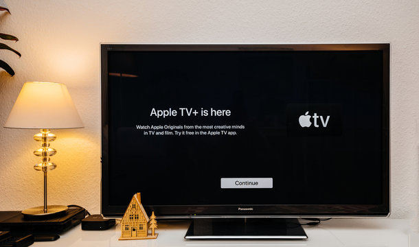 Paris, France - Nov 1, 2019: Apple TV plus is here message on living room display with try for free continue button launch first day over-the-top ad-free subscription video on demand web television