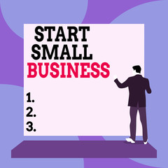 Conceptual hand writing showing Start Small Business. Concept meaning Aspiring Entrepreneur a New Venture Trade Industry Back view Man dressed standing platform facing blank rectangle