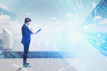 Businessman with clipboard in city, network
