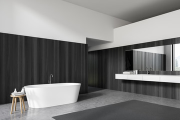 Fototapeta na wymiar Dark wood and white bathroom corner, tub and sink