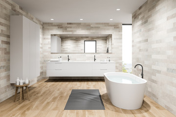 Naklejka na ściany i meble Comfortable light tile bathroom with wardrobe