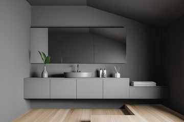Gray bathroom interior with sink and mirror