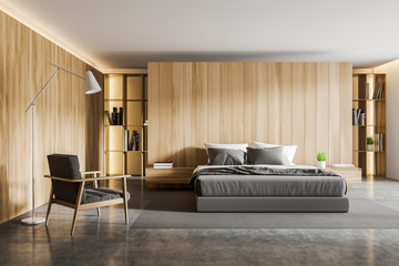 Wooden bedroom interior with armchair