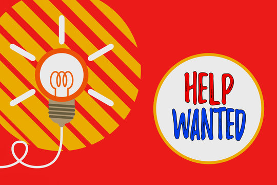 Text sign showing Help Wanted. Business photo showcasing An ad in the paper an employer places to find a new employee Big idea light bulb. Successful turning idea invention innovation. Startup