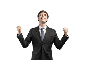 Happy young businessman celebrating, isolated