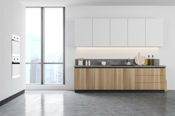 White kitchen interior with wooden counters