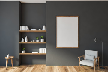 Fototapeta premium Gray living room with armchair, shelves, poster
