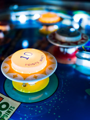 Antique Pinball Machine Bumpers with Motion Blur Ball