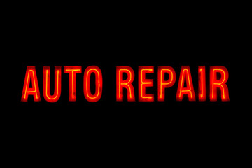 Fototapeta na wymiar A vintage auto repair neon sign in red