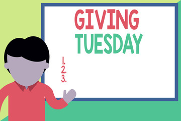 Conceptual hand writing showing Giving Tuesday. Concept meaning international day of charitable giving Hashtag activism Man standing front whiteboard pointing to project photo Art
