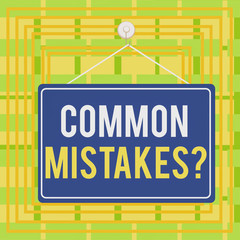 Text sign showing Common Mistakes question. Business photo showcasing repeat act or judgement misguided or wrong Colored memo reminder empty board blank space attach background rectangle