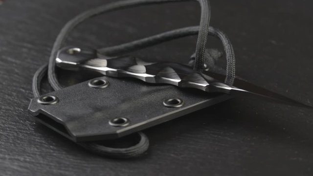 Custom hand crafted japanese kiridashi knife on the turning slate board table
