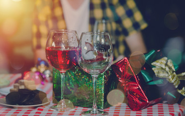 Group of friends to enjoy Christmas party filled with gift boxes a variety of colors and food. They celebrated until the morning in the living room.