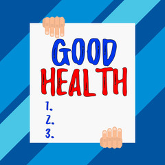 Conceptual hand writing showing Good Health. Concept meaning state of being vigorous and free from bodily or mental disease Two hands holding big blank rectangle up down design