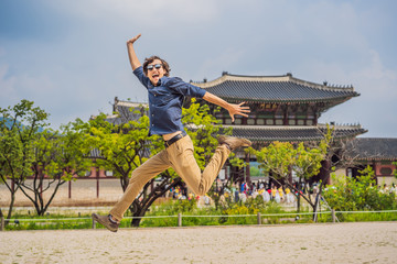 Man tourist in korea. Korean palace grounds in Seoul, South Korea. Travel to Korea concept