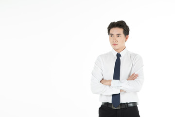 Portrait of asian man smiles and folds his arms looking to the left with copy space, isolated on white background. For motivation, finance, business, achievement, power and entrepreneur concept.
