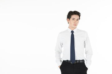 Portrait of asian man smiles, arms in pants pocket, and looks straight, isolated on white background with copy space. For motivation, finance, business, achievement, power and entrepreneur concept.