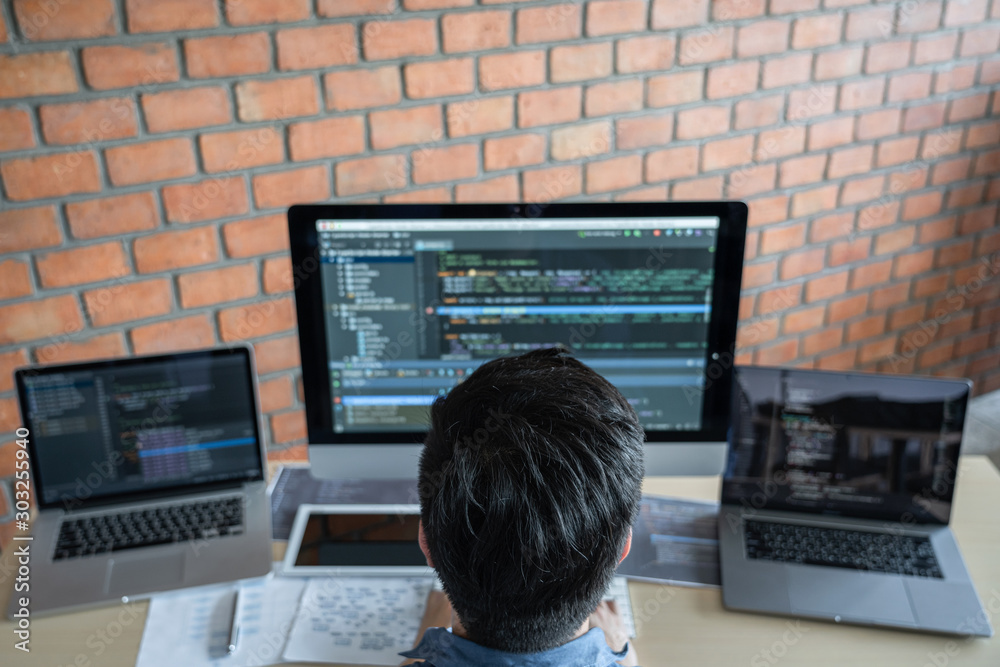 Aufkleber Young Professional programmer working at developing programming and website working in a software develop company office, writing codes and typing data code, Programming with HTML, PHP and javascript