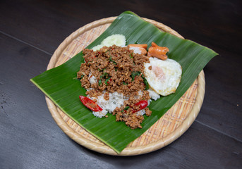 Rice topped with stir-fried pork and basil