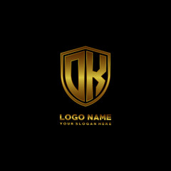 Initial letters DK shield shape gold monogram logo. Shield Secure Safe logo design inspiration