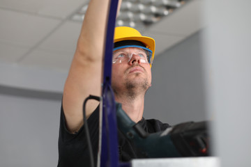Workman on ladder at job © H_Ko