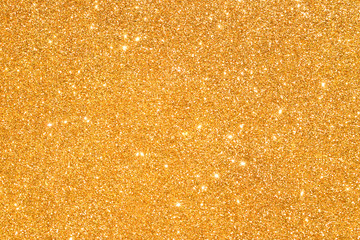 sparkles of golden glitter abstract background