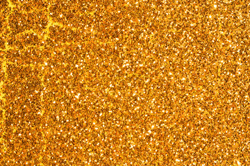 sparkles of golden glitter abstract background	