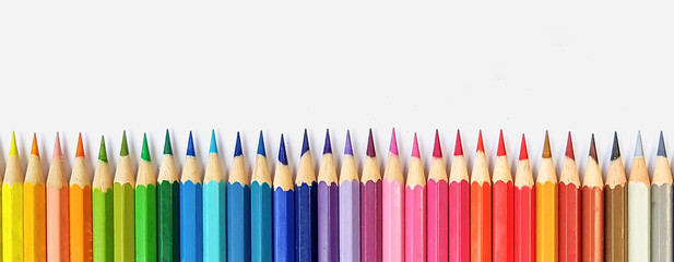 Color pencils isolated on white background close up with Clipping path.Beautiful color pencils.Color pencils for drawing  Rainbow color pencil and used as a background. - obrazy, fototapety, plakaty