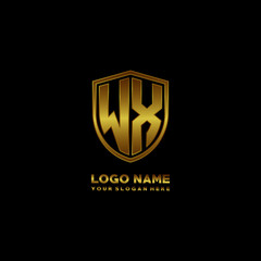 Initial letters WX shield shape gold monogram logo. Shield Secure Safe logo design inspiration