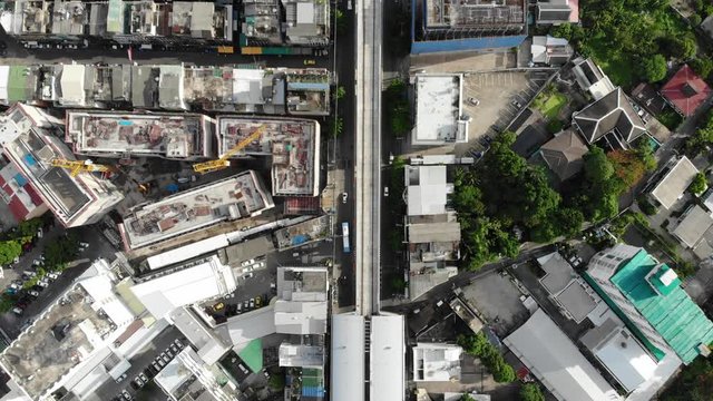 City office building with house and vehicle movement aerial view Bangkok Thailand