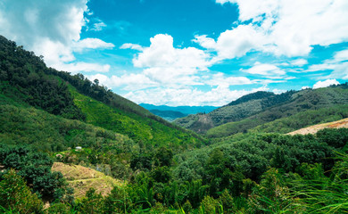 Obraz premium landscape beautiful countryside mountains and ground ,cloud and blue sky background . 