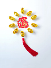 Chinese New Year ingots flat lay series on white background. Middle Chinese word "ZHAO CAI JIN BAO" means bring in wealth and treasure -- felicitous wish of making money.    