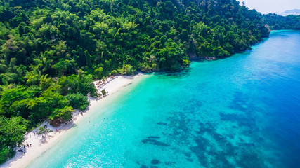 Aerial view of nature clear blue sea water with topical beach forest Andaman sea, Traveling Myanmar Thailand, Top view from drone, Beautiful destination place Asia, Summer holiday vacation travel trip