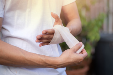 Men use Elastic bandage on wrists isolated .Concept is a wrist protector