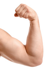 Arm of male bodybuilder isolated on white