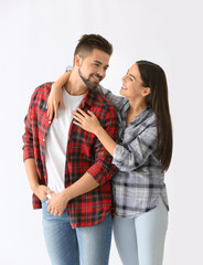 Portrait of happy young couple on white background