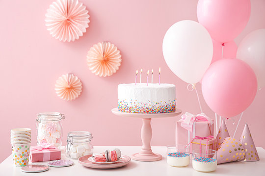 Tasty Candy Bar For Birthday Party On Table Against Color Background