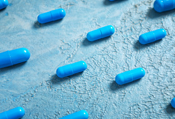 Many pills on color background