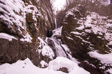 Fototapeta na wymiar Snow scene and waterfall