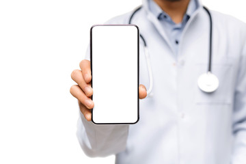 Male doctor demonstrating smartphone with blank screen for advertisement