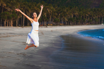 Fototapeta na wymiar young girl on tropical island beach