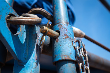 Close up at metal pin which is use to secure the working platform. Industrial equipment object photo.