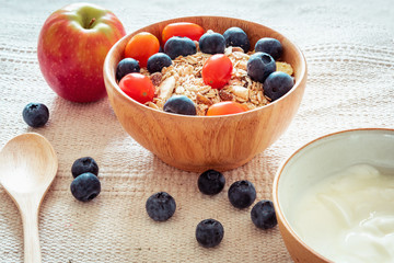Breakfast Healthy Nature Vegetarian Food With Milk, Granola, Muesli and Natural Fresh Fruit on The Table., Granola With Yogurt for Diet Eating and Healthcare Concept., Homemade Nutrition Food.