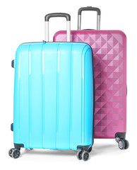 Packed suitcases on white background