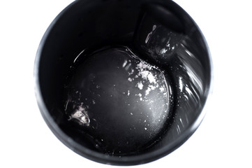 Sports shaker with water and soluble creatine powder. On a white background isolate.