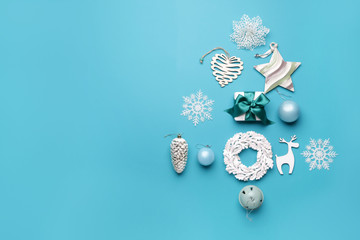 Beautiful Christmas tree made of decor on color background