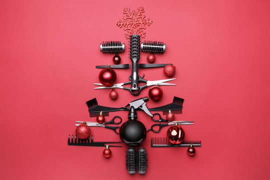 Beautiful Christmas tree made of hairdresser tools on color background