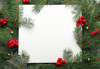 Beautiful Christmas composition with blank card and fir branches