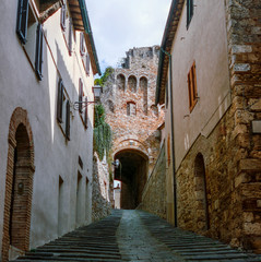 The old narrow streets in the medieval town of Massa Marittima in Tuscany shot with analogue film technique - 9
